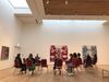 People sat on chairs in a circle in the Mead Gallery