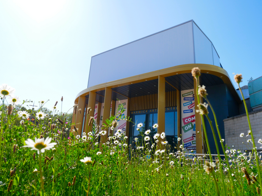 Warwick Arts Centre Exterior with flowers in the foreground