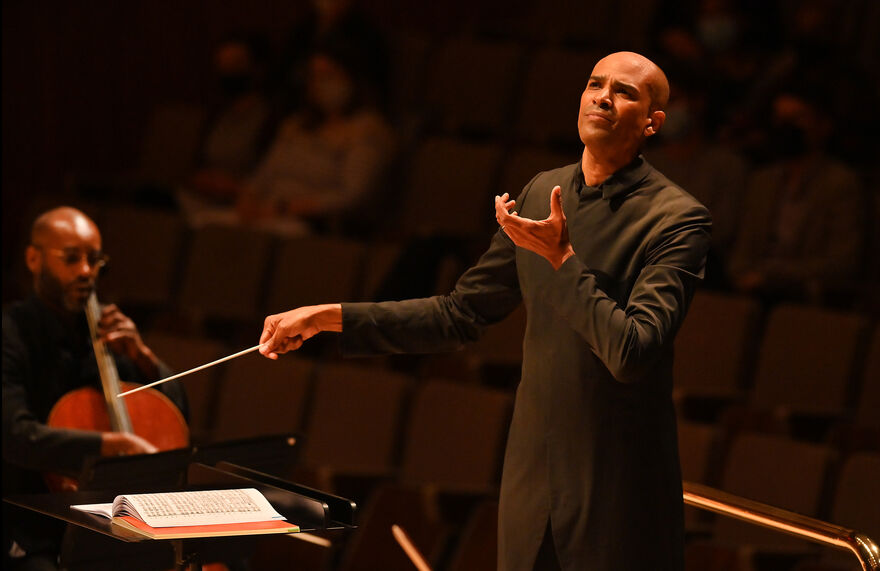 Conductor with one hand in the air