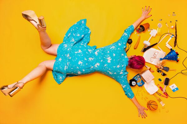 Woman laying on a yellow floor Woman laying on a yellow floor