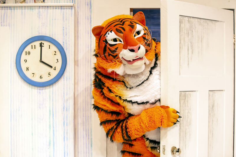 A performer dressed as a tiger