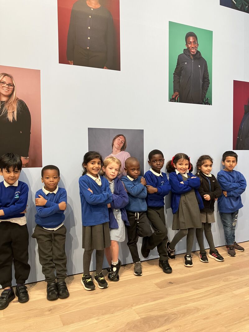 School Children stood in front of artwork in gallery