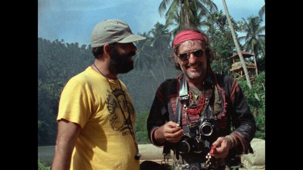 Francis Ford Coppola and Dennis Hopper laugh together on set of Apocalypse Now. 