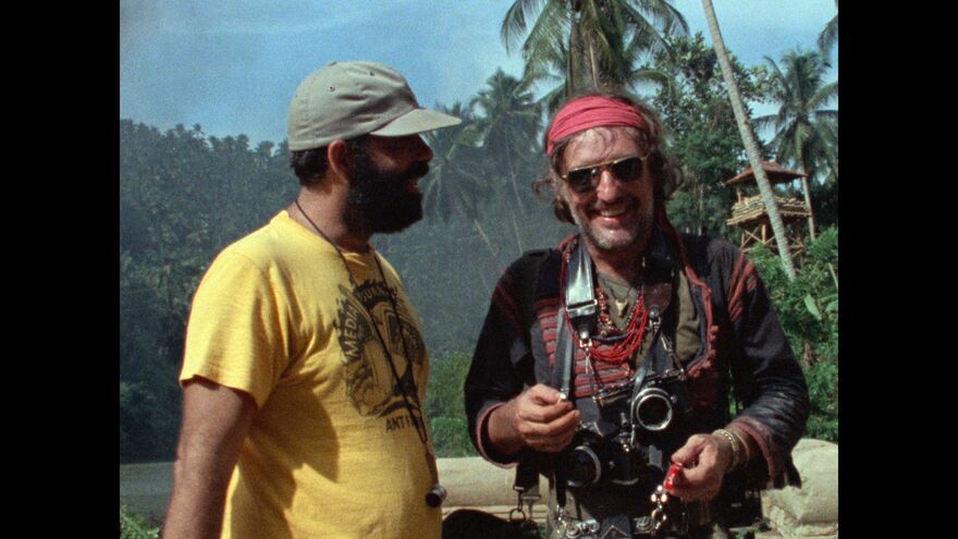 Francis Ford Coppola and Dennis Hopper laugh together on set of Apocalypse Now.