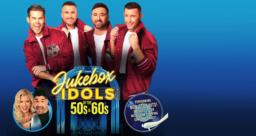 Four men in red jackets standing behind a jukebox