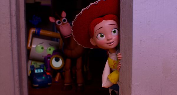 Jessie the cowgirl peeks out of a wardrobe with a small smile. Other toys can be seen in the background. Jessie the cowgirl peeks out of a wardrobe with a small smile. Other toys can be seen in the background.