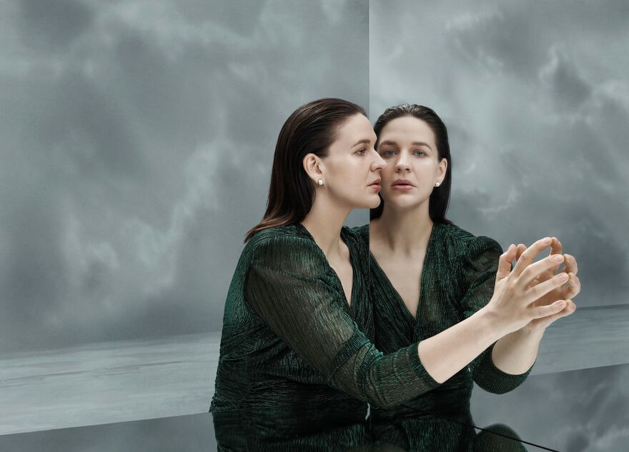 Soprano opera singer Lise Davidsen looks into a mirror.
