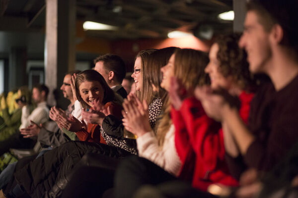 Row of an audience clapping