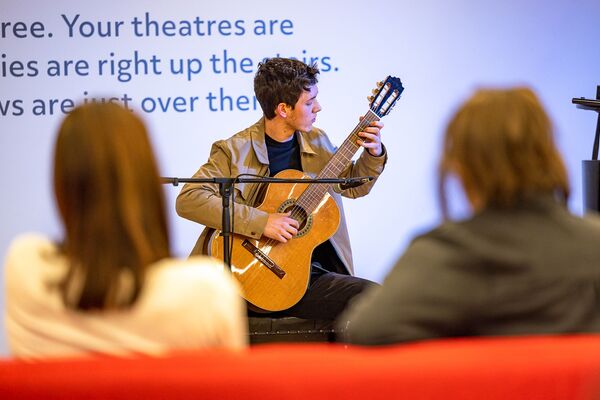 Man sat playing guitar