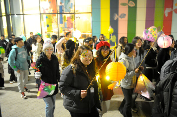Students engaging in the Global Illuminations Procession