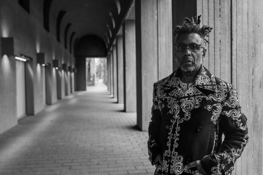 A black and white portrait of the musician Omar.