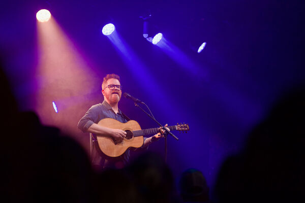 John Smith singing on stage