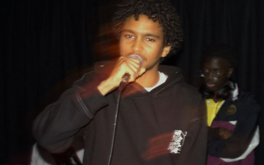 A man singing into a microphone