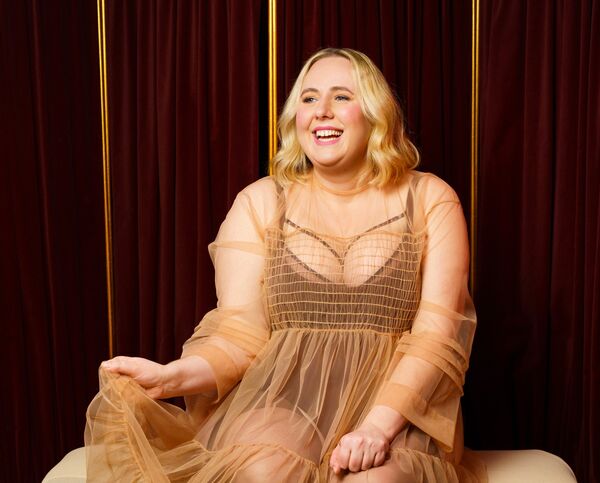 Helen Bauer in a flowing sheer dress 