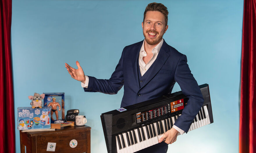 James B Partridge holding a keyboard