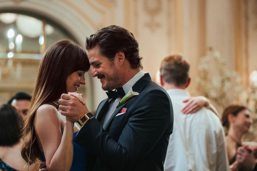 A man and woman dance together. 