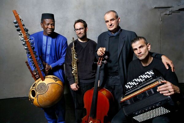 Sissoko, Segal, Parisien, Peirani holding jazz instruments 