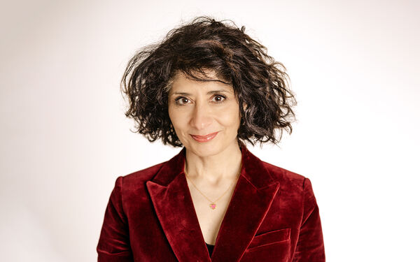 Shaparak Khorsandi in a dark red suede jacket
