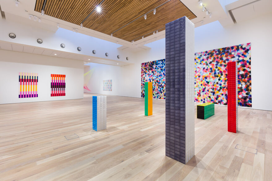 Reflective pillars and a colourful polkadot wall, as part of the Rana Begum exhibition