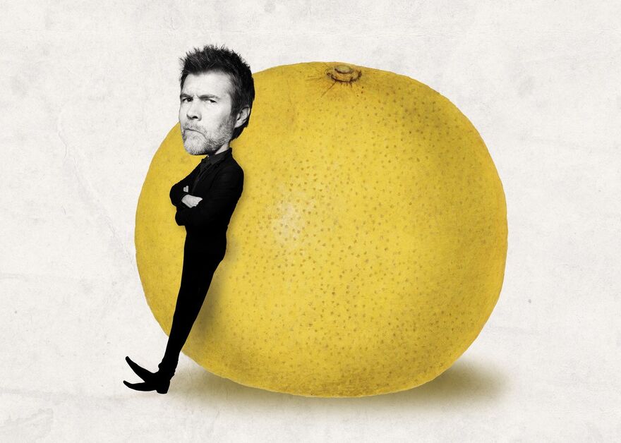 Graphic with Rhod Gilbert leaning against a giant grapefruit