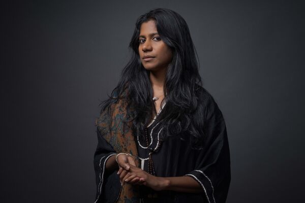 ganavya in a black dress