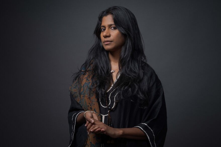 ganavya in a black dress